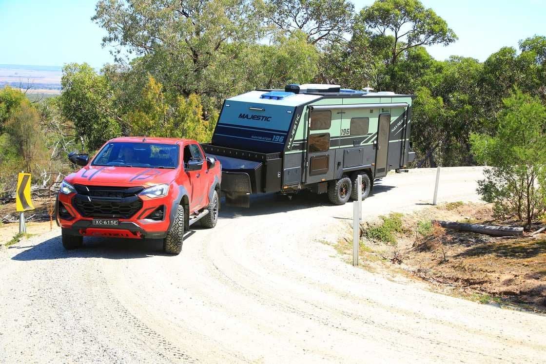 Navigator 196 towed down a hilltop gravel road