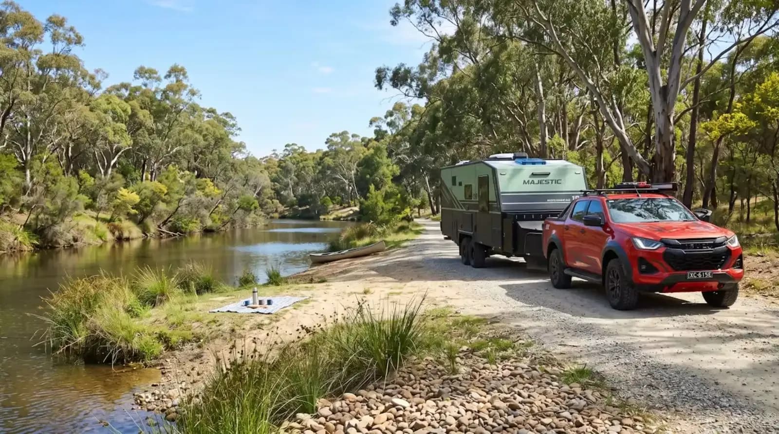 A Majestic parked at a riverbank camp