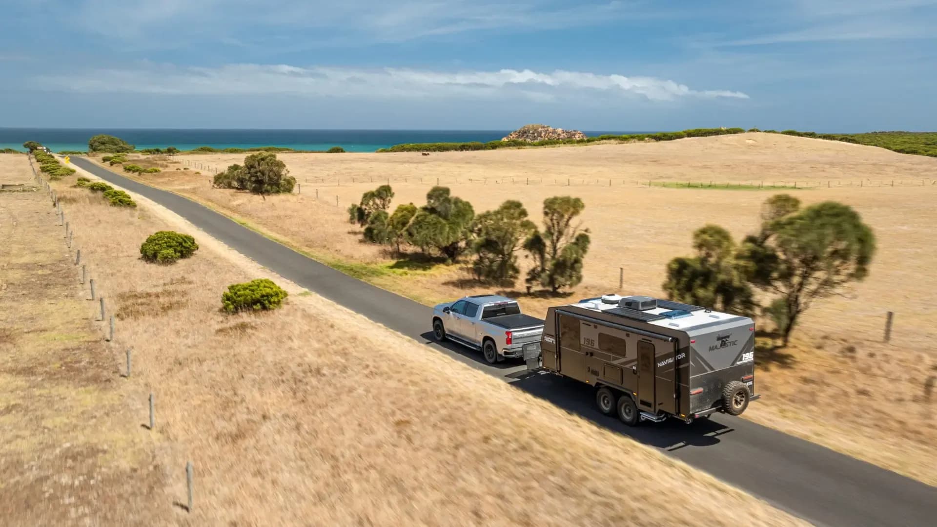 Navigator towed along a coastal road toward the sea